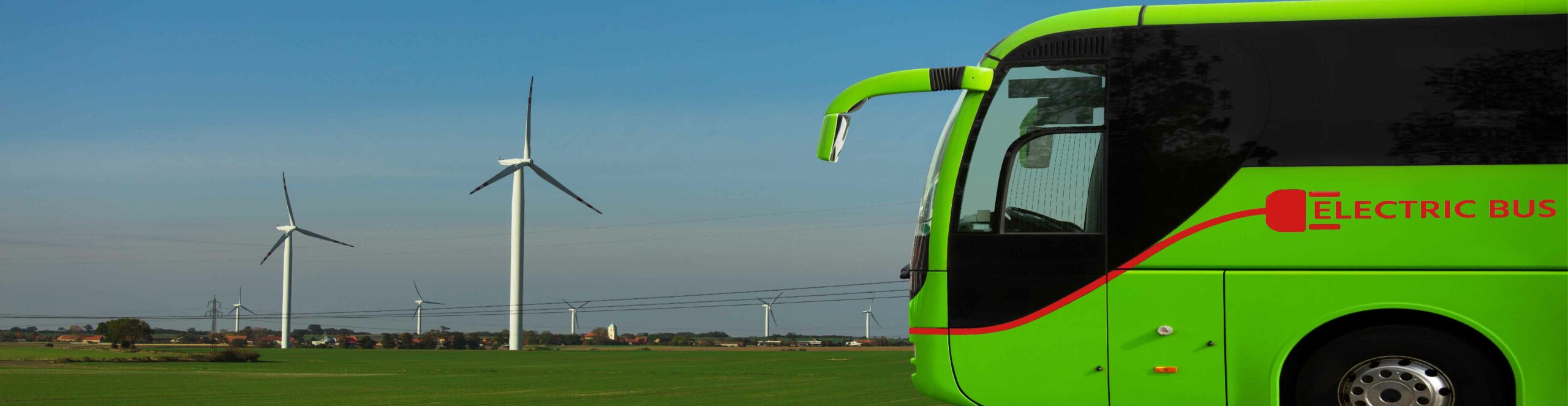 Electric bus charging in a field of wind turbines