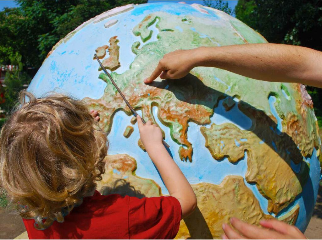 Child looking at the globe